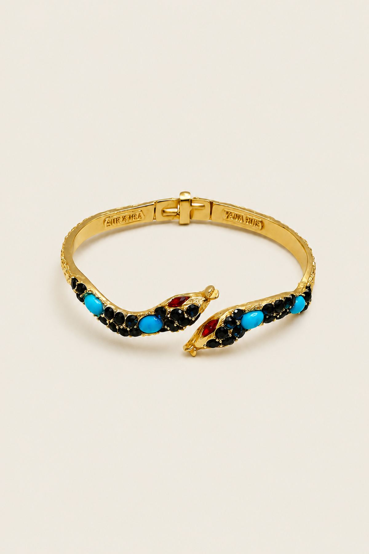 Pulsera Padé con diseño de serpiente y cristales azul zafiro, accesorio elegante y sofisticado para un look moderno y exclusivo