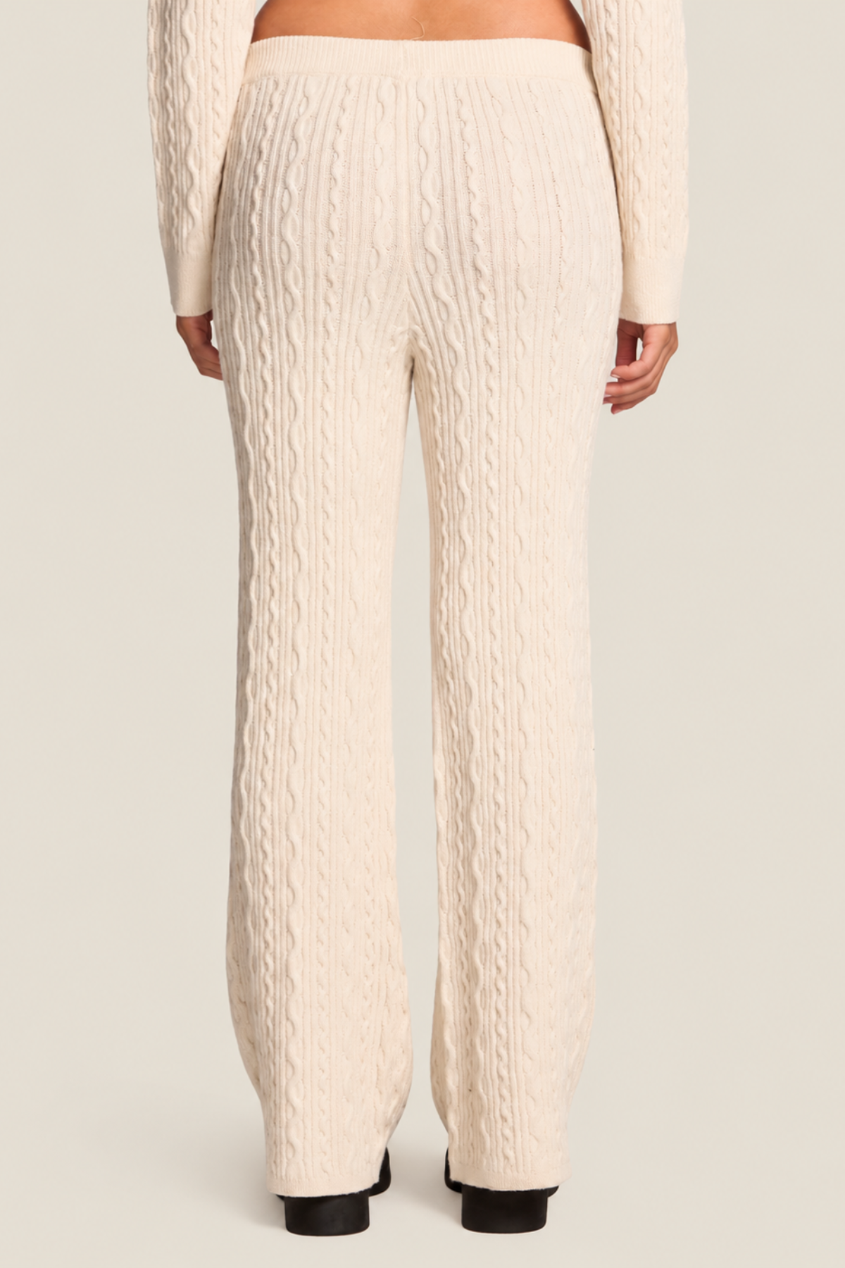 Pantalón de punto blanco antiguo para mujer vista trasera con cintura elástica