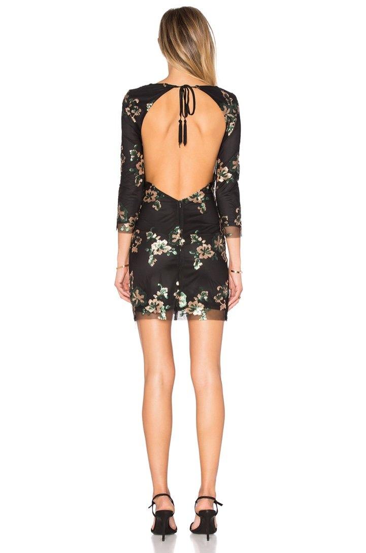 Vestido mini Wyldr Dancing In The Dark en negro visto de espaldas, mostrando el diseño elegante y ajuste ceñido